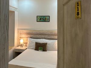 Postel nebo postele na pokoji v ubytování Hotel La Magdalena