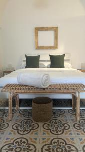 a bedroom with a large bed and a mirror at Vicolo 4 Locazione Turistica in Monopoli