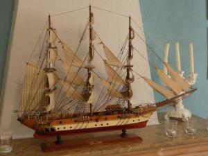 a model of a ship sitting on a table at Hostal Villa Maruja in El Arenal