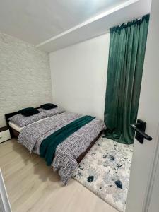 Postel nebo postele na pokoji v ubytování Apartament 2 camere