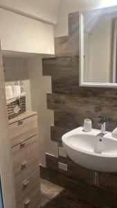 a bathroom with a sink and a mirror at Vicolo 4 Locazione Turistica in Monopoli