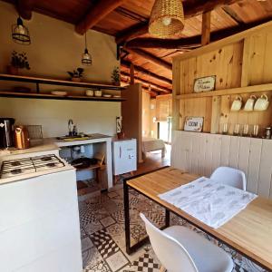 a kitchen with a table and some chairs in it at El Silencio 2 - Quebrada - Lozano - Yala - Jujuy in Lozano