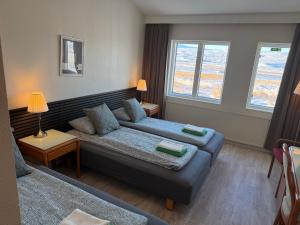 Postel nebo postele na pokoji v ubytování Frost Guesthouse