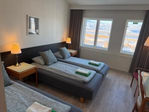 Postel nebo postele na pokoji v ubytování Frost Guesthouse