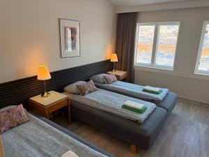 Postel nebo postele na pokoji v ubytování Frost Guesthouse