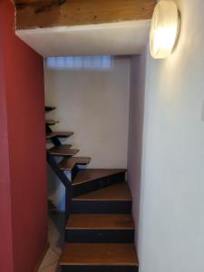 a staircase in a house with wooden steps at Appartamento Sara in Rovigo