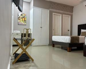 TV a/nebo společenská místnost v ubytování Hotel La Magdalena