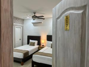Postel nebo postele na pokoji v ubytování Hotel La Magdalena