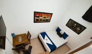 TV i/ili multimedijalni sistem u objektu Hotel Lleras # 1 +5 fotografija