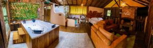 a view of a bathroom with a sink and a couch at Cabañas Campestres Yugos in Sutatausa