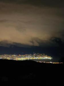 a view of a city at night with lights at villa ain zaytouna tanger in Tangier