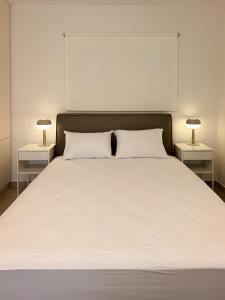 Ένα ή περισσότερα κρεβάτια σε δωμάτιο στο Casa Quattro by Immobilis