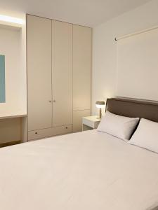 Ένα ή περισσότερα κρεβάτια σε δωμάτιο στο Casa Quattro by Immobilis