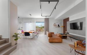 a living room with a couch and a table at Nice Home In Dobrinj With Wifi in Dobrinj