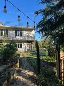 a house with a fence in front of it at Rcheuli Villa in Charnali in Batumi +17 photos
