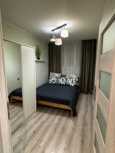 Ένα ή περισσότερα κρεβάτια σε δωμάτιο στο Apartament Niedurnego 38