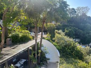 an overhead view of a garden with trees and benches at Marbella Boutique Art suites in Marbella