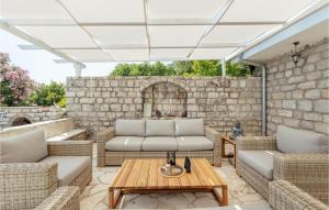a patio with two couches and a table at Stunning Home In Herceg Novi With Wifi in Herceg-Novi +18 photos