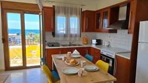 a kitchen with a table with a plate of food on it at Calliestia 6 in Agia Ermioni