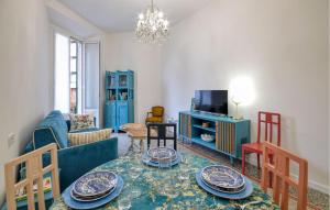 a living room with a table with plates on it at Casa Maria Paola in Santa Margherita Ligure