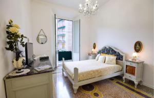 a bedroom with a bed and a chandelier at Casa Maria Paola in Santa Margherita Ligure
