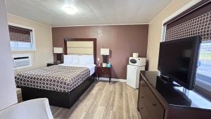 Postel nebo postele na pokoji v ubytování Rogers Motel