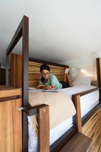 Postel nebo postele na pokoji v ubytování SUUT Hostal Boutique