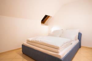 Voodi või voodid majutusasutuse Hirschenhof Apartments toas