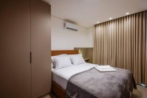 Ένα ή περισσότερα κρεβάτια σε δωμάτιο στο Flat 03 Exclusivo +17 φωτογραφίες