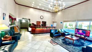 a large living room with couches and a tv at Studio 6 Suites Portland, OR Downtown OHSU in Portland