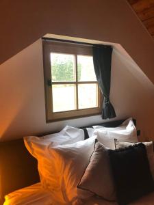 Postel nebo postele na pokoji v ubytování Le Chalet De Saint-Hubert