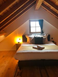 Postel nebo postele na pokoji v ubytování Le Chalet De Saint-Hubert