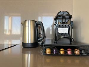 a coffeemaker sitting on a counter next to a coffee pot at Stelle di Verona - Andromeda in Verona
