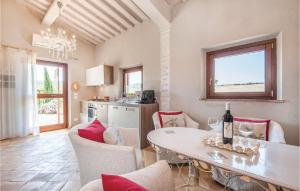 a kitchen and living room with a table and chairs at La Casa Della Fata in Montenero