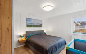 a bedroom with a bed and a window at Amazing Home In Wandlitz Ot Zerpenschl in Berg +12 photos