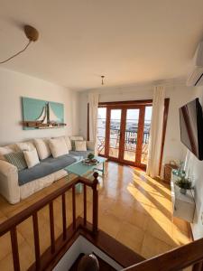 a living room with a couch and a table at Eslanzarote Casa Eneida sea views, super wifi in Tías
