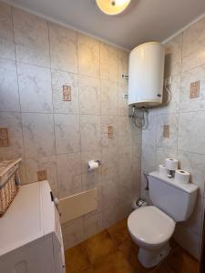 a small bathroom with a toilet and a sink at Eslanzarote Casa Eneida sea views, super wifi in Tías +45 photos