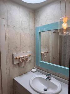 a bathroom with a sink and a mirror at Eslanzarote Casa Eneida sea views, super wifi in Tías