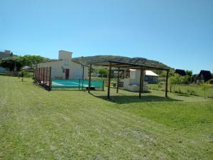 a park with a playground with a picnic shelter at Lafiaca in Sierra de la Ventana