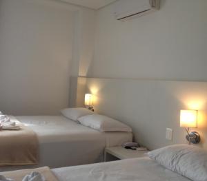 Postel nebo postele na pokoji v ubytování Hotel São Mateus