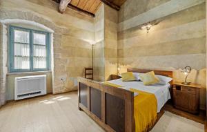 a bedroom with a large bed and a window at Villa Castela in Vela Traba