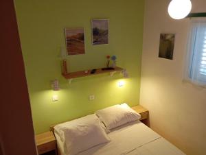 Postel nebo postele na pokoji v ubytování Apartments Ivo