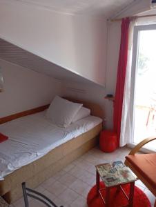 Postel nebo postele na pokoji v ubytování Apartments Ivo
