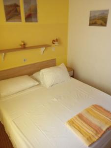 Postel nebo postele na pokoji v ubytování Apartments Ivo
