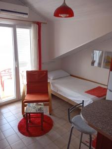 Postel nebo postele na pokoji v ubytování Apartments Ivo