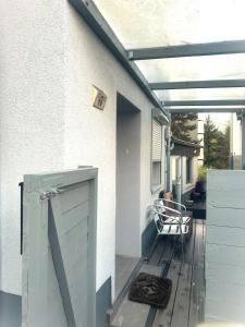 an open door on a porch with a deck at Ferienwohnung Bina in Trier