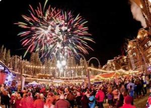 a crowd of people standing in front of a fireworksestival at Luxury 3 BDR Northstar Condo in Truckee +17 photos