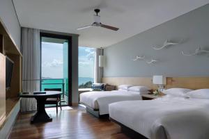Rayong Marriott Resort & Spa客房内的一张或多张床位