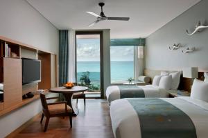 Rayong Marriott Resort & Spa客房内的一张或多张床位