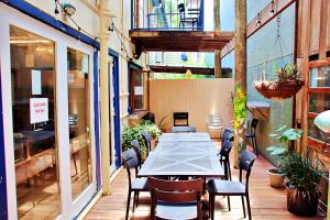 an outdoor patio with a table and chairs at Brisbane Manor in Brisbane